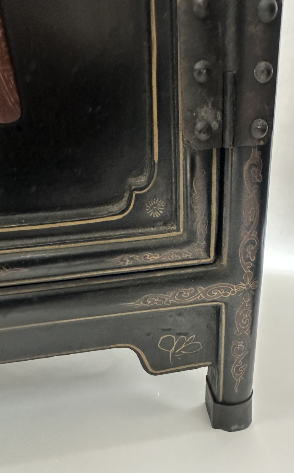 A pair of black lacquered two-door Chinoiserie cabinets featuring carved hardstone inlays of horses, animals, and vessels, topped with gilt scrollwork motifs. View XVII