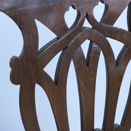 A George III laburnum armchair featuring a carved pierced back splat, swept armrests, and a rust-brown upholstered seat. View V