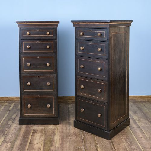 fig 2. A pair of tall Victorian laburnum Wellington chests with five graduated drawers, fine string inlay, turned wooden knobs, and plinth bases.