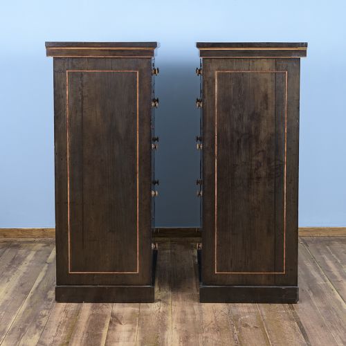 fig 3. A pair of tall Victorian laburnum Wellington chests with five graduated drawers, fine string inlay, turned wooden knobs, and plinth bases.