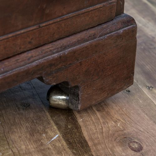 fig 1. A George II Cuban mahogany chest featuring brass drop handles, keyhole escutcheons, a top brushing slide, two short drawers, two long drawers, and bracket feet.
