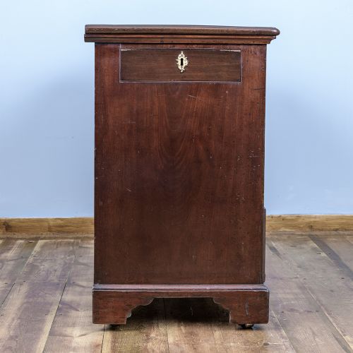 A George II Cuban mahogany chest featuring brass drop handles, keyhole escutcheons, a top brushing slide, two short drawers, two long drawers, and bracket feet. View XI