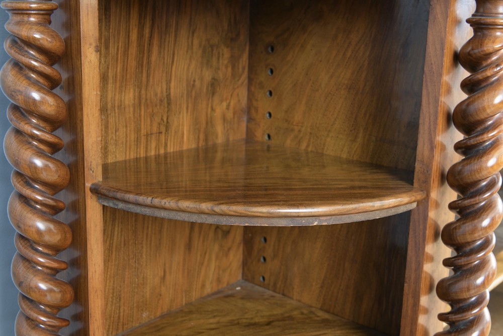 A mid-19th-century burr walnut and amboyna side cabinet featuring open shelves, barley-twist column accents, and a curved breakfront silhouette. View V