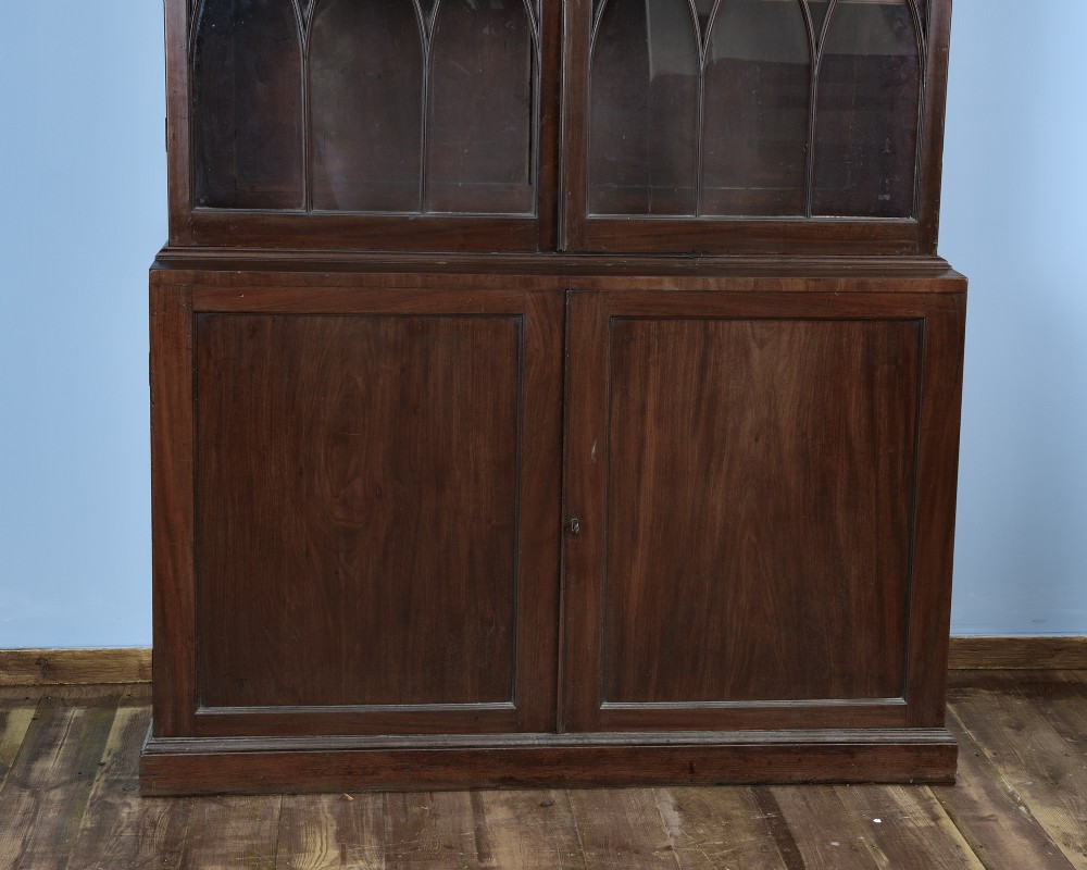 An 18th-century George III mahogany library bookcase featuring two upper glazed doors with Gothic astragal bars and two lower panelled cupboard doors. View III