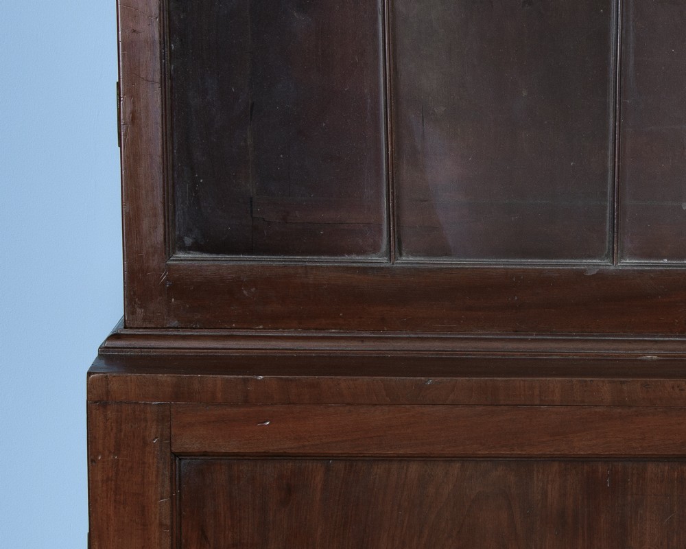 An 18th-century George III mahogany library bookcase featuring two upper glazed doors with Gothic astragal bars and two lower panelled cupboard doors. View IV