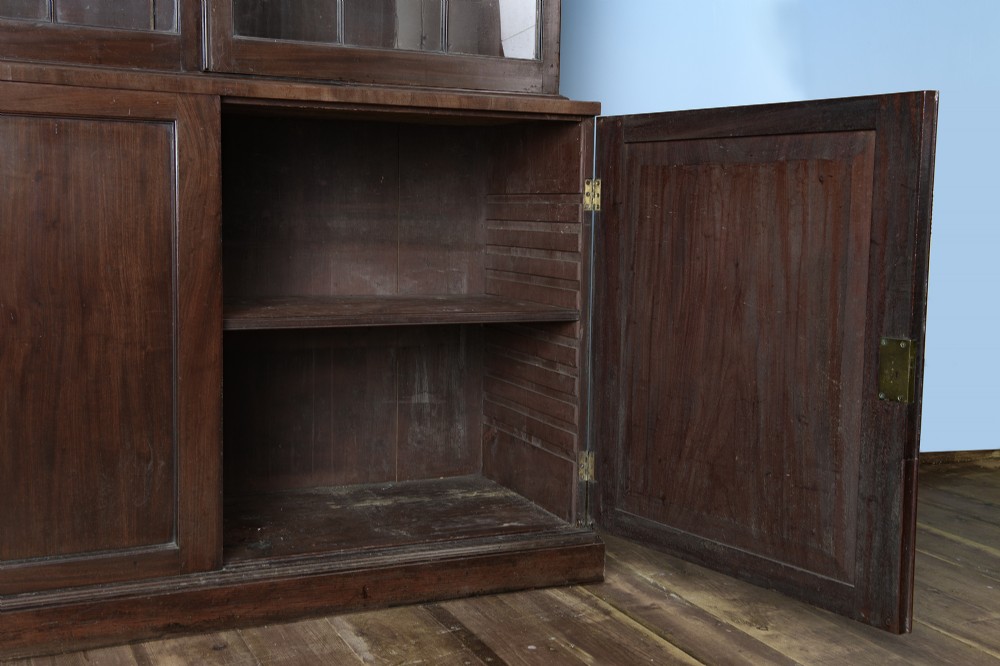 An 18th-century George III mahogany library bookcase featuring two upper glazed doors with Gothic astragal bars and two lower panelled cupboard doors. View V