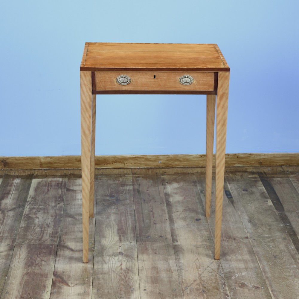 An 18th-century Georgian satinwood cheveret writing table featuring slender square tapered legs, brass ring pulls, and a upper cabinet with an integrated handle. View XI
