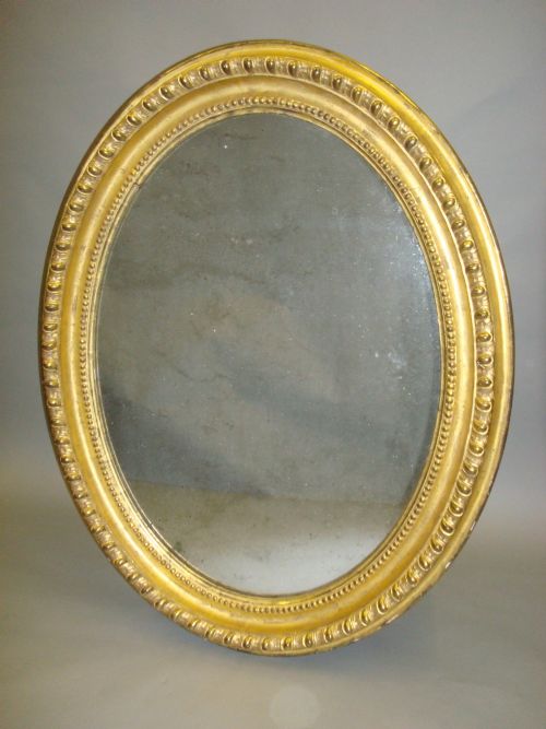 An Early C19th Giltwood Oval Wall Mirror