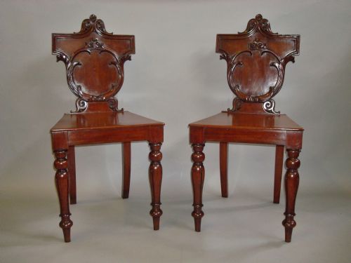 Late Regency Pair of Irish Mahogany Hall Chairs
