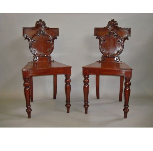Late Regency Pair of Irish Mahogany Hall Chairs