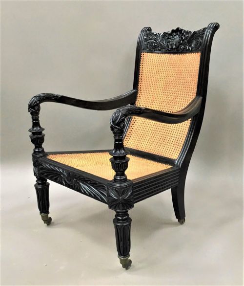 fig 1. C19th Indian carved ebony open arm library chair; finely carved in solid ebony. Galle District, Ceylon