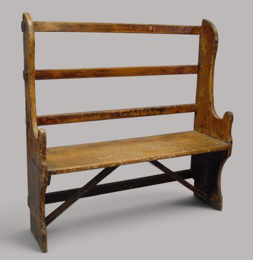 Georgian primitive scumble pine settle; of unusual form and neat proportions