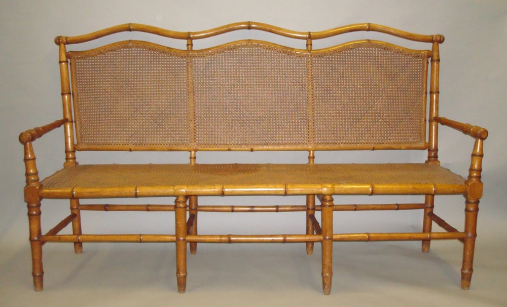 A stylish C19th cherrywood faux bamboo settee/hall seat