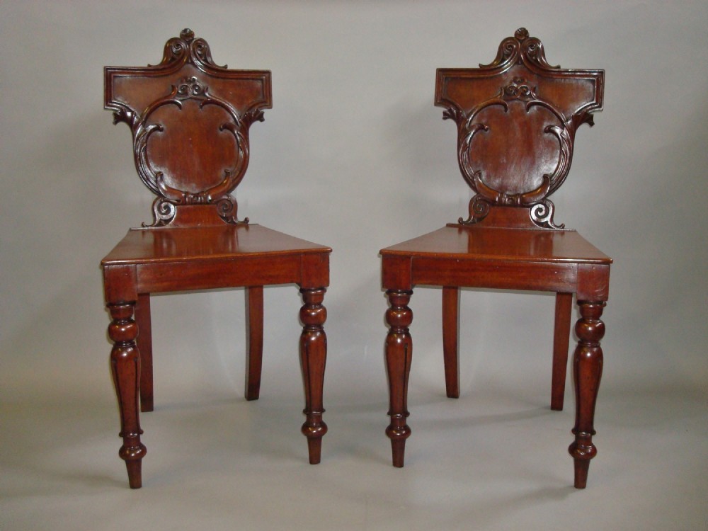 Late Regency Pair of Irish Mahogany Hall Chairs