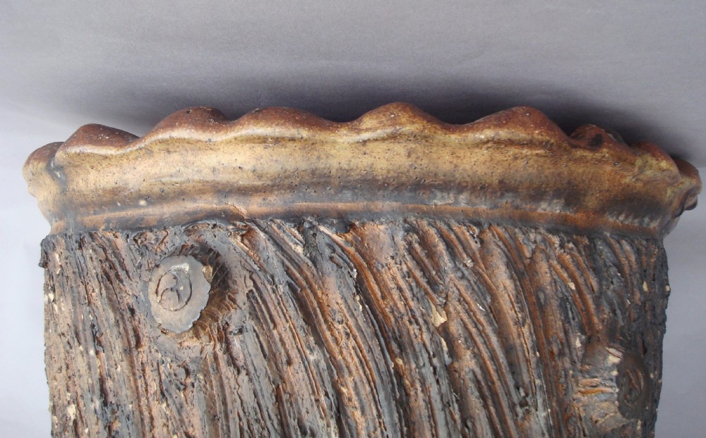 A nineteenth-century brown terracotta jardiniere textured to resemble bark with a scalloped upper rim. View IX