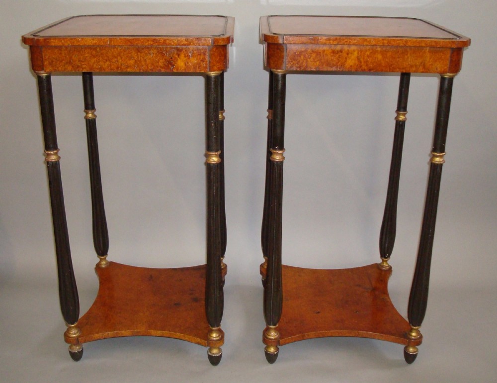 A pair of tall Regency occasional tables featuring square amboyna tops, ebonised turned legs with gilt accents, and concave undertiers. View III