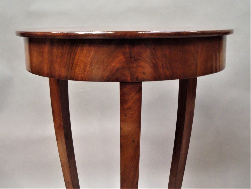 A pair of matching nineteenth-century round mahogany occasional tables featuring shaped legs and circular tops against a neutral background. View VII
