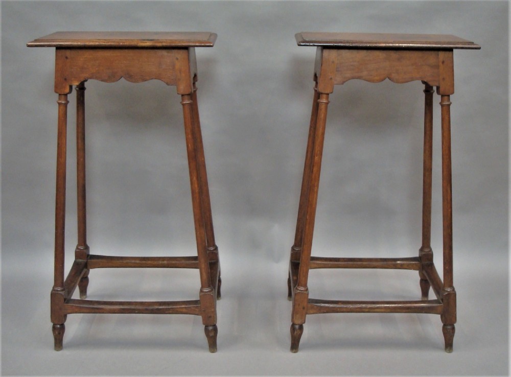 A pair of tall 19th-century oak stands featuring rectangular tops, scalloped aprons, slender turned legs, and low box stretchers. View III