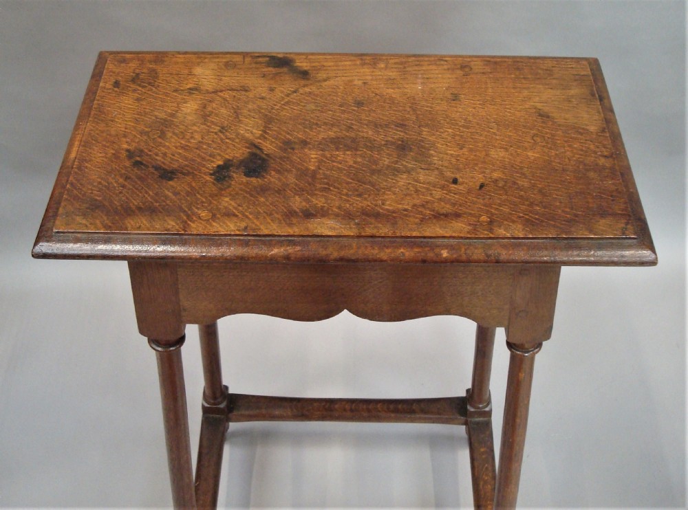 A pair of tall 19th-century oak stands featuring rectangular tops, scalloped aprons, slender turned legs, and low box stretchers. View IV