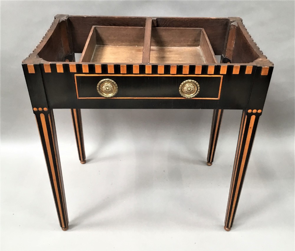 An early nineteenth-century Dutch Neoclassical side table constructed with ebonised timber, satinwood inlay, a rectangular white marble top, and tapered square legs. View IV