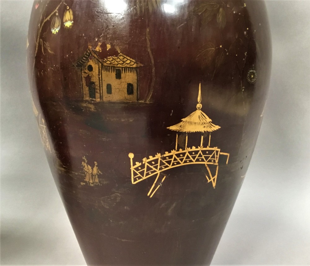 A pair of 19th-century dark brown lacquered papier-mache vases decorated with detailed gilt chinoiserie pagoda landscapes. View XV