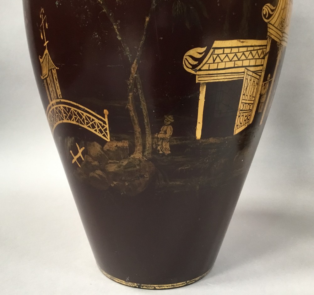 A pair of 19th-century dark brown lacquered papier-mache vases decorated with detailed gilt chinoiserie pagoda landscapes. View XVI