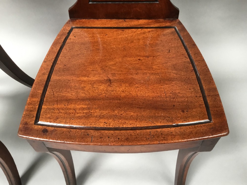 Regency pair of mahogany hall chairs View XIV