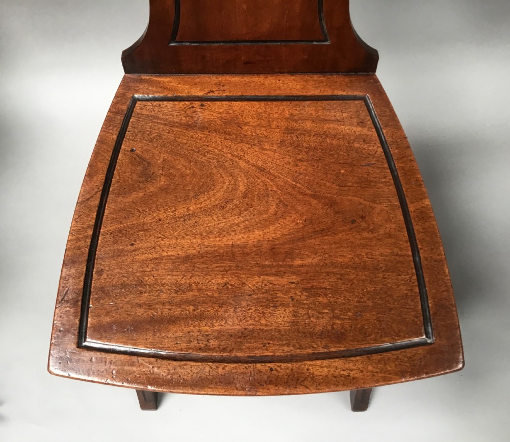 Regency pair of mahogany hall chairs View XV