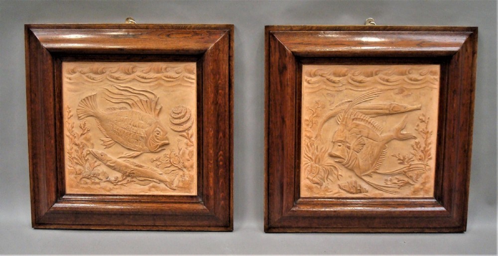C19th pair of terracotta plaques sculpted with fish and marine life