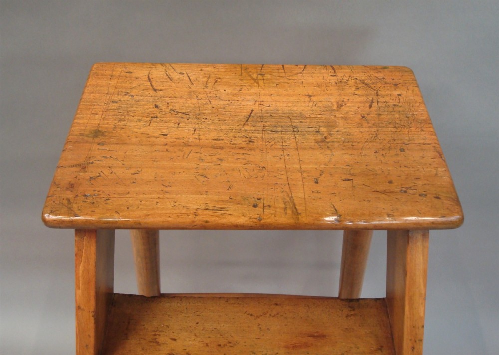 A nineteenth-century English fruitwood library ladder with four steps, a top platform, and turned back legs. View XIV