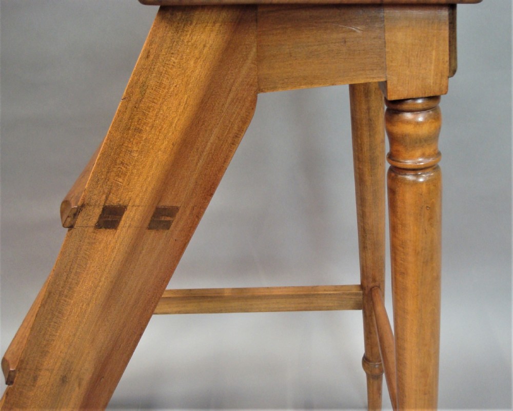 A nineteenth-century English fruitwood library ladder with four steps, a top platform, and turned back legs. View XIX