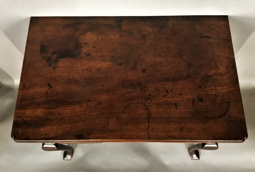 An 18th-century George II mahogany lowboy table featuring three drawers with brass drop handles, a shaped apron, and four cabriole legs with pad feet. View II