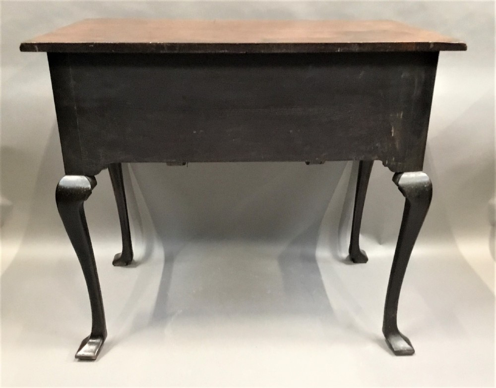 An 18th-century George II mahogany lowboy table featuring three drawers with brass drop handles, a shaped apron, and four cabriole legs with pad feet. View XVIII