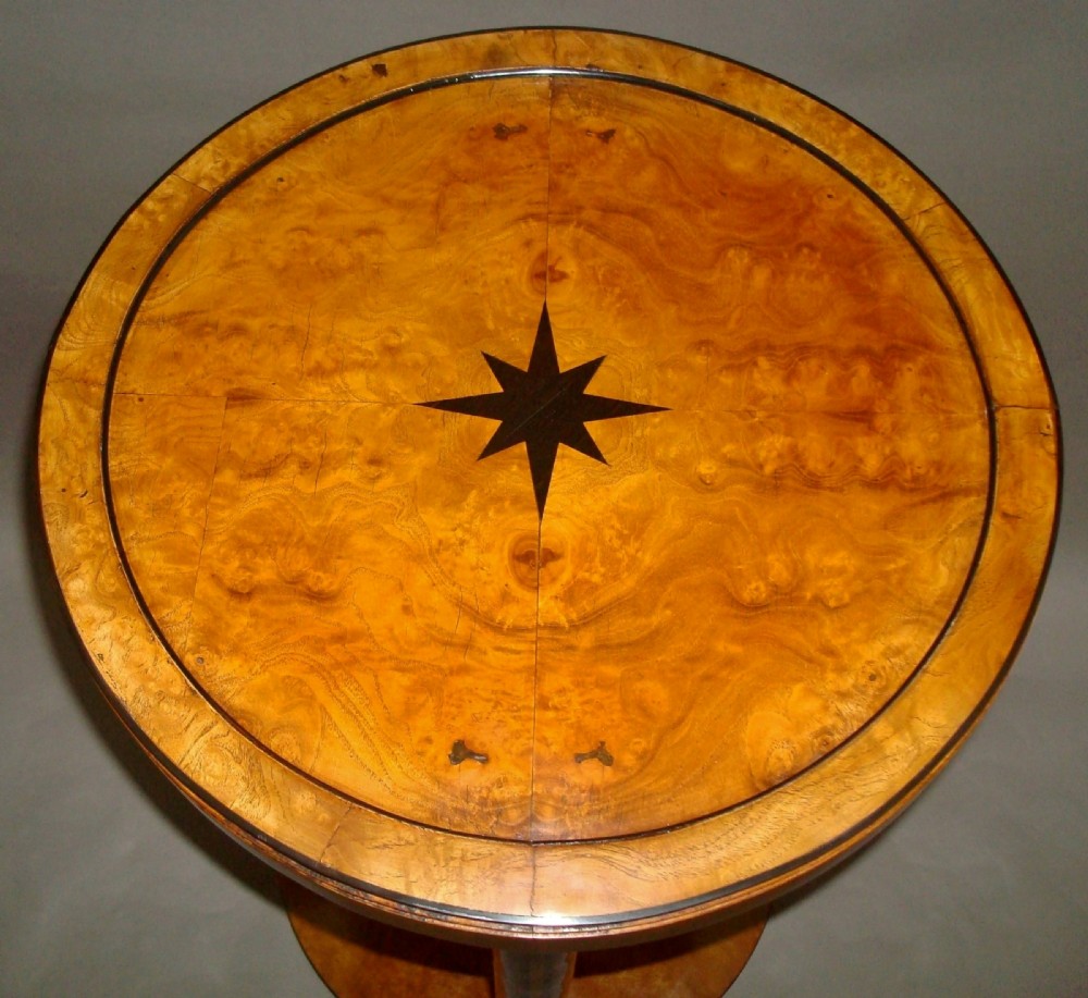 A pair of circular burr elm occasional tables featuring inlaid ebony star motifs, slender vertical legs with black stringing, and an ebony-banded lower tier. View IV