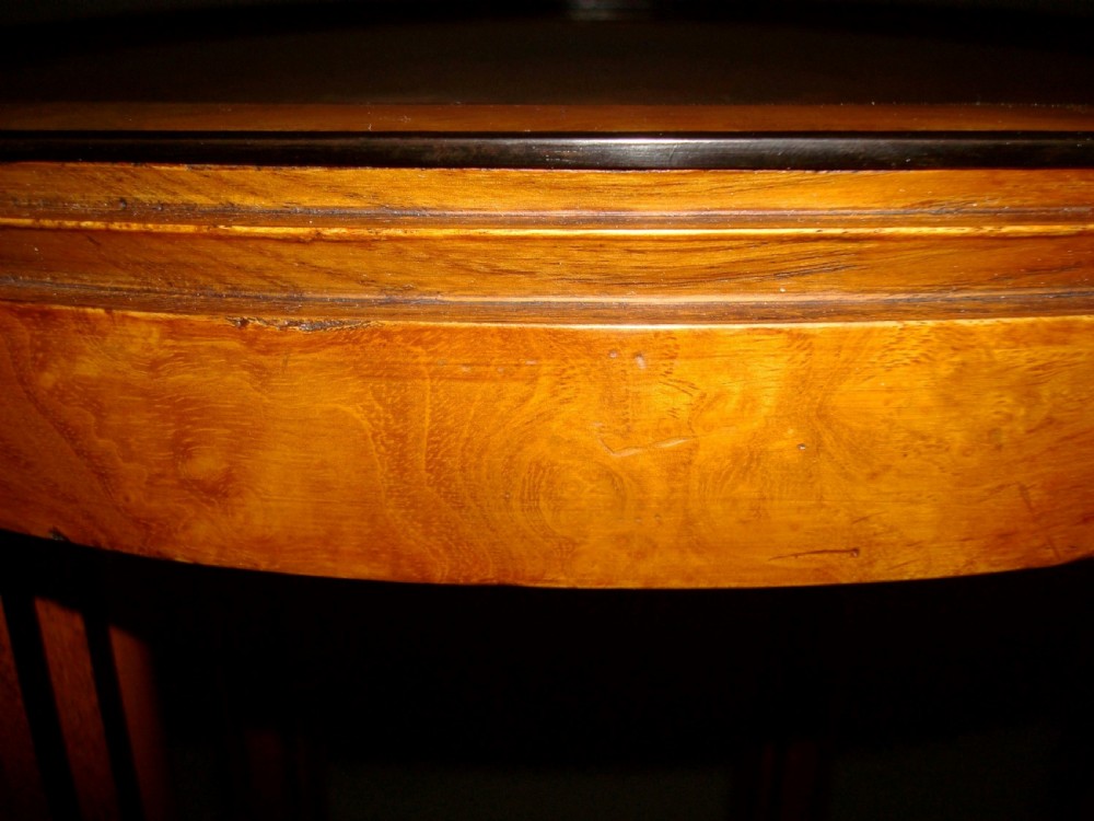 A pair of circular burr elm occasional tables featuring inlaid ebony star motifs, slender vertical legs with black stringing, and an ebony-banded lower tier. View IX