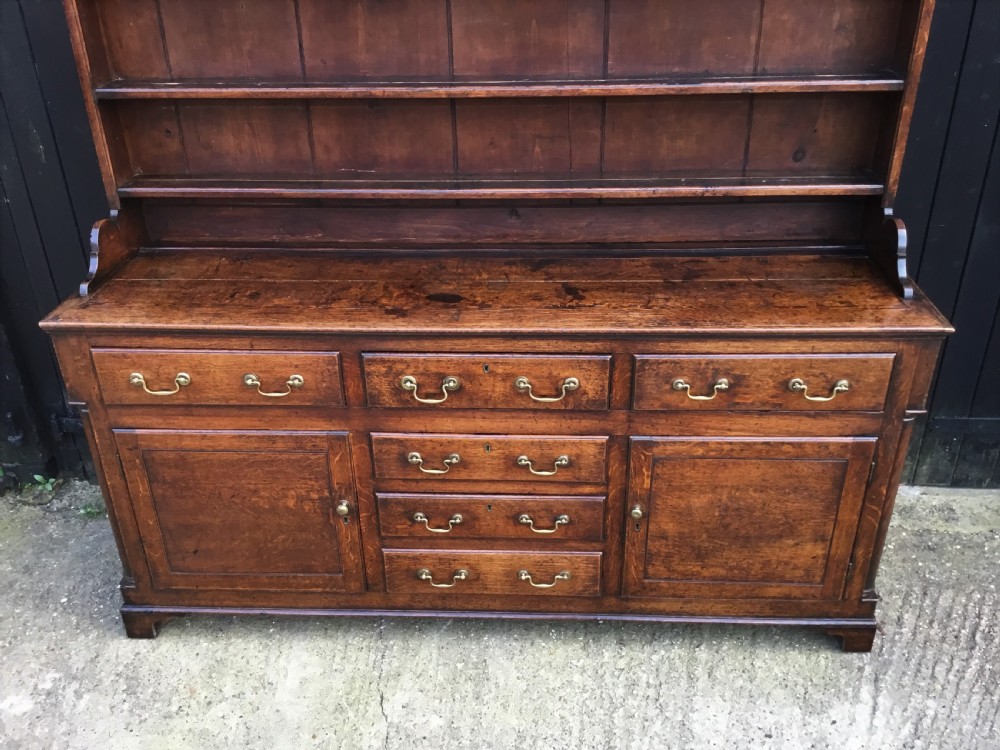 Georgian oak dresser with cupboard base and original rack View V