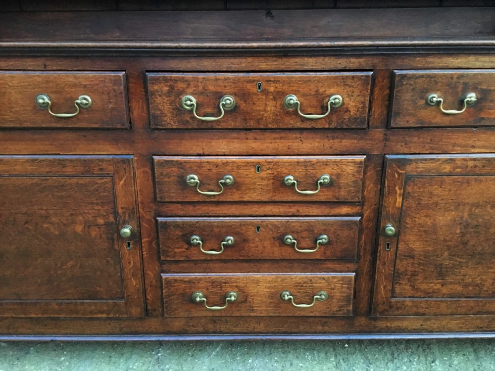 Georgian oak dresser with cupboard base and original rack View IX