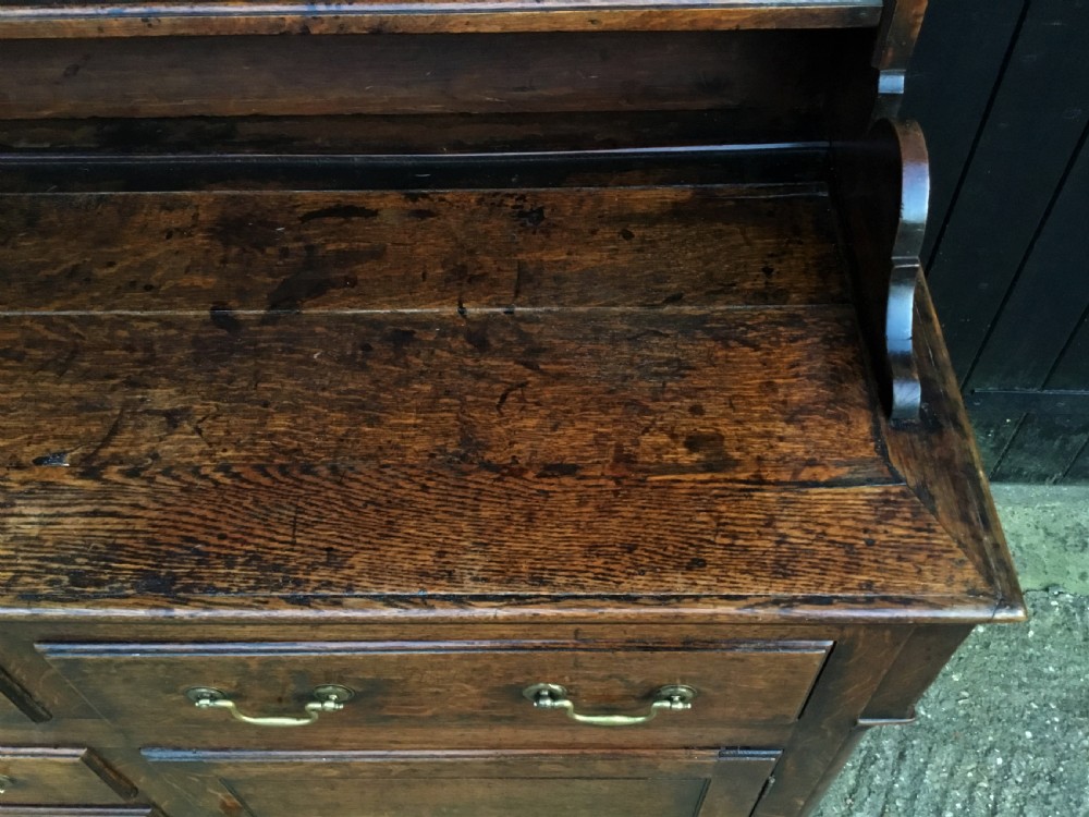 Georgian oak dresser with cupboard base and original rack View XIII