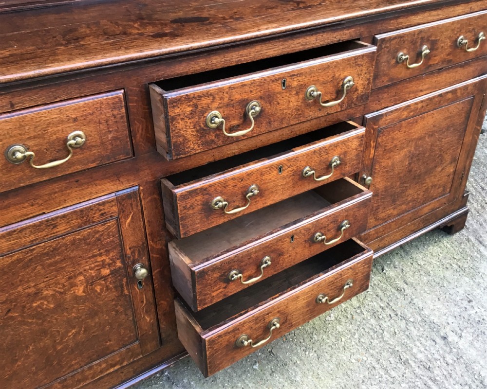 Georgian oak dresser with cupboard base and original rack View XIV