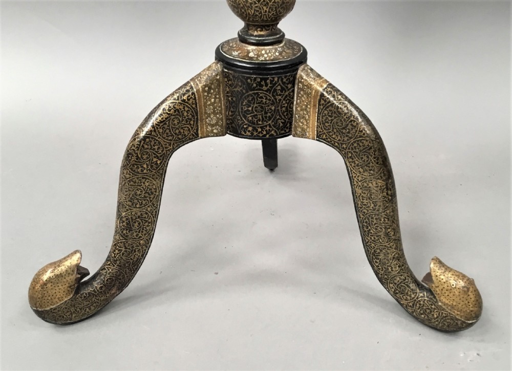 A late 19th-century Kashmiri occasional table with a scalloped top, central turned pedestal, tripod base, and gold floral paintwork. View V