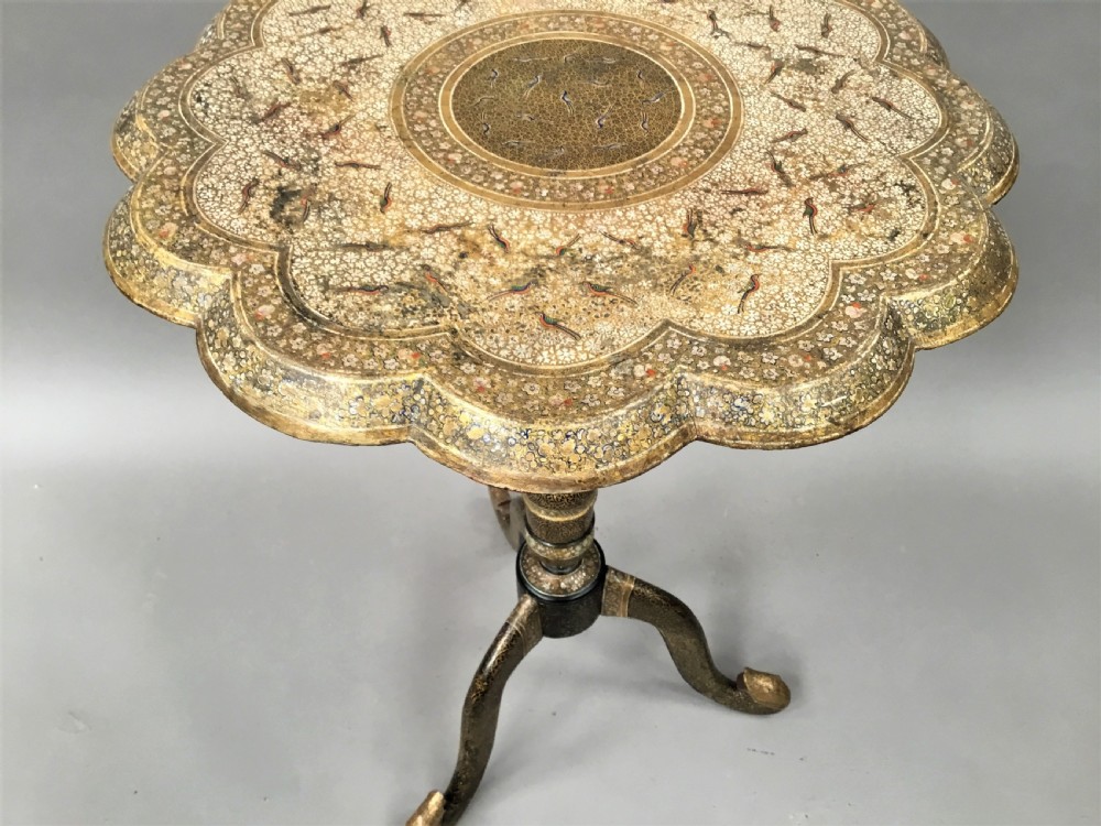 A late 19th-century Kashmiri occasional table with a scalloped top, central turned pedestal, tripod base, and gold floral paintwork. View IX