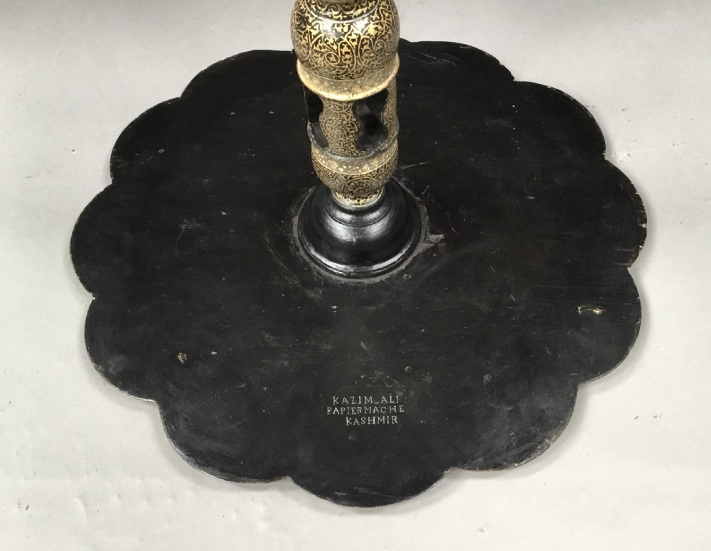 A late 19th-century Kashmiri occasional table with a scalloped top, central turned pedestal, tripod base, and gold floral paintwork. View XVII