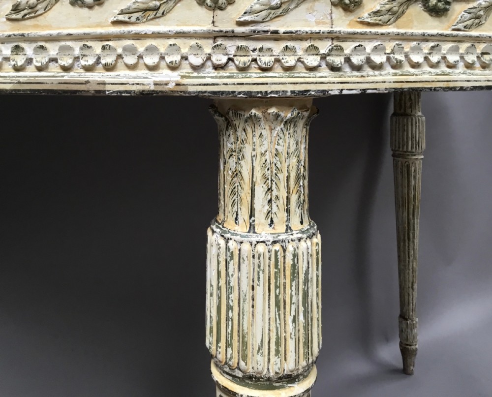 An 18th-century Italian Neoclassical demilune console table featuring an off-white painted timber frame with fluted tapered legs and a dark green marble top. View IX