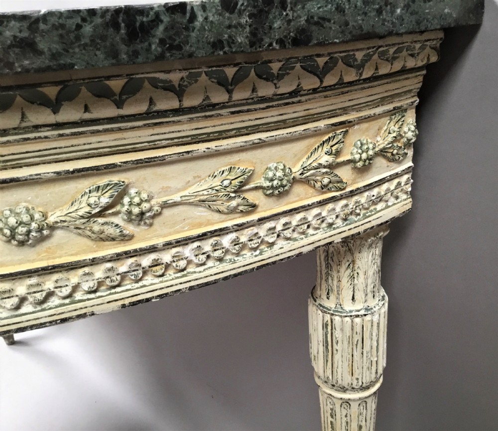 An 18th-century Italian Neoclassical demilune console table featuring an off-white painted timber frame with fluted tapered legs and a dark green marble top. View XIV
