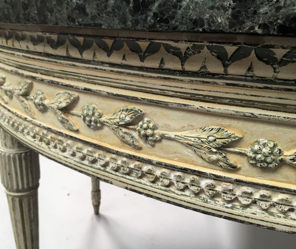 An 18th-century Italian Neoclassical demilune console table featuring an off-white painted timber frame with fluted tapered legs and a dark green marble top. View XV