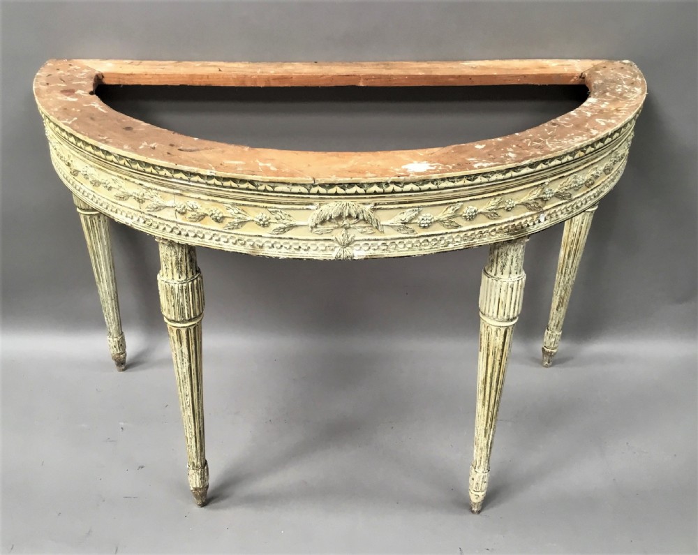An 18th-century Italian Neoclassical demilune console table featuring an off-white painted timber frame with fluted tapered legs and a dark green marble top. View XIX