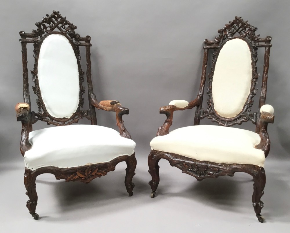 C19th pair of Black Forest open armchairs