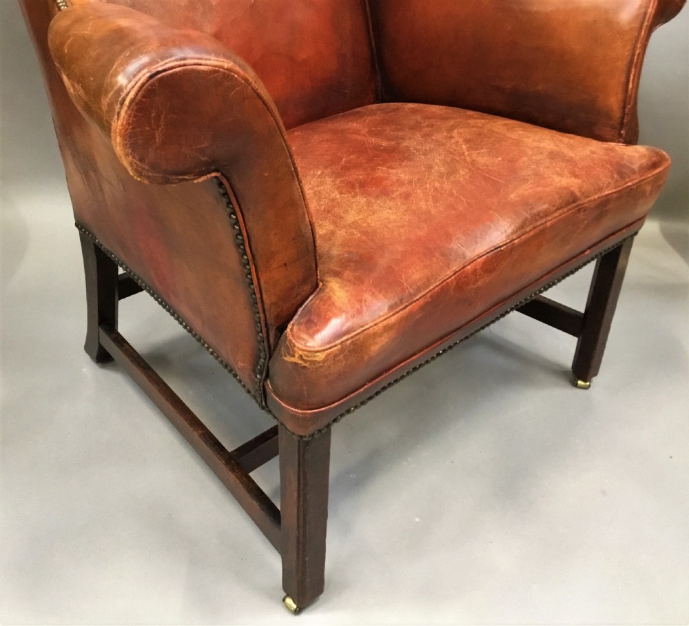 George III mahogany and leather wing chair of generous proportions View V