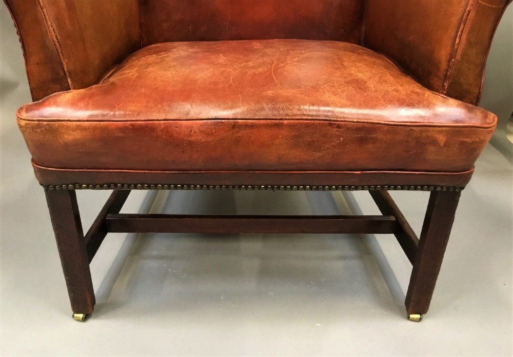 George III mahogany and leather wing chair of generous proportions View XI