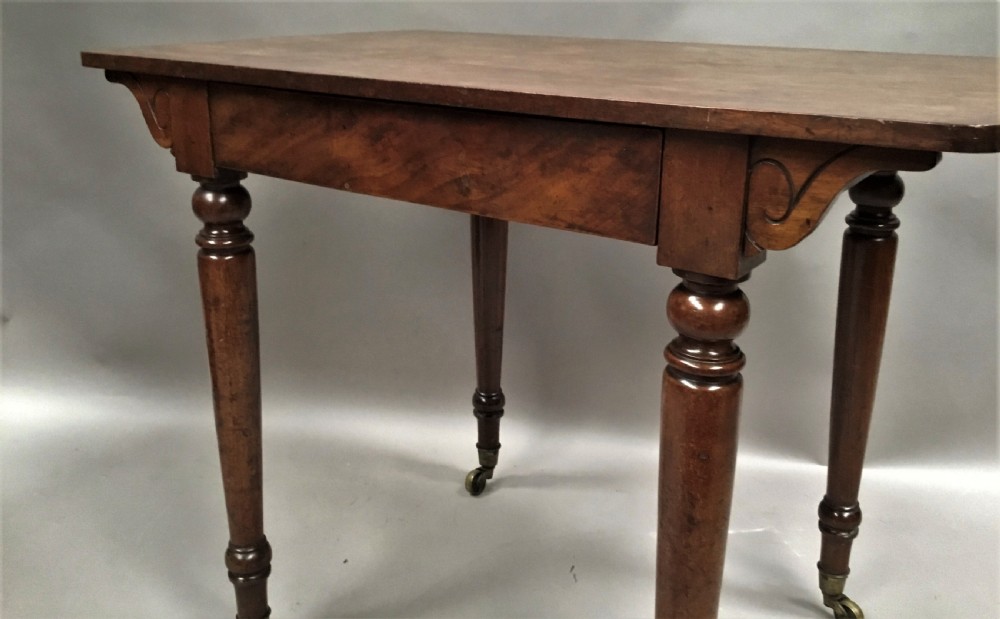 C19th mahogany side table / writing table by Holland and Sons, London View IX